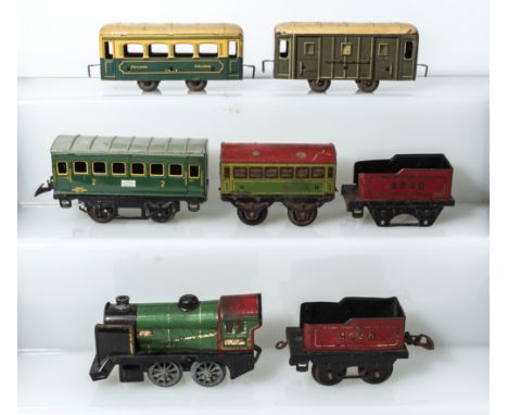 French Hornby clockwork engine 3615 together with two tenders, passenger car and three other small passenger cars