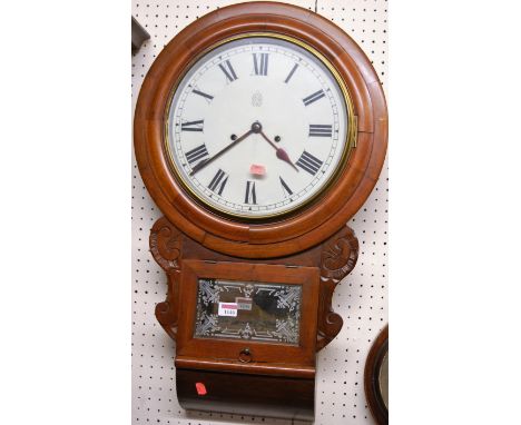 A Victorian mahogany circular drop trunk wall clock, the white enamel dial with lozenge shape trade mark