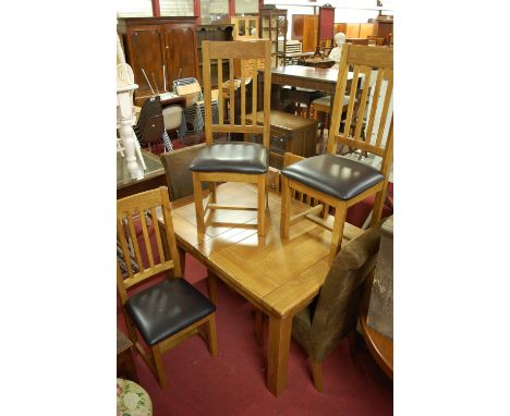 A contemporary light oak dining suite, comprising; extending dining table, having pull-out action and two extra drop-in leave