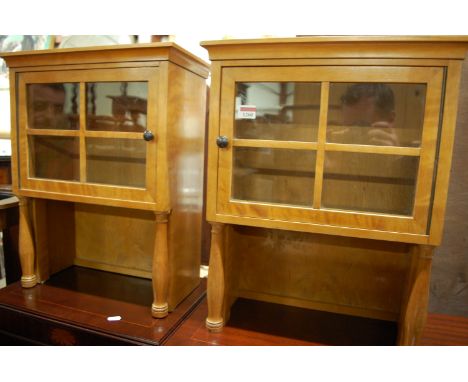 A pair of circa 1900 satinwood glazed compartments in the Biedermeier taste (formerly upper sections of larger item of furnit
