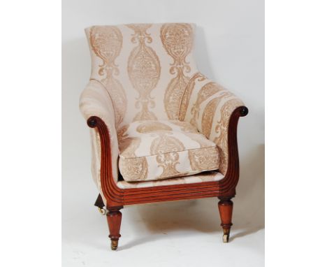 A William IV mahogany showframe library armchair, re-upholstered in velour, having loose cushion, the frame with scroll arms 