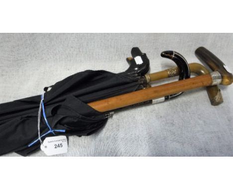 A COLLECTION OF VINTAGE UMBRELLAS AND WALKING CANES including silver mounted and other examples