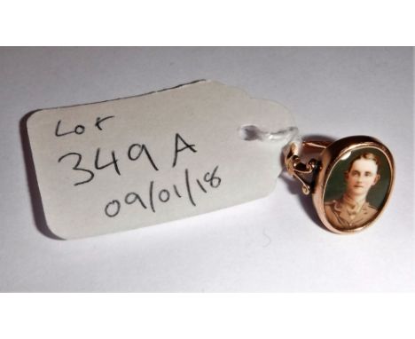 A 19TH CENTURY YELLOW METAL SIGNET RING, set with a porcelain portrait of a Great War Officer, circa size J (c.4gms)
