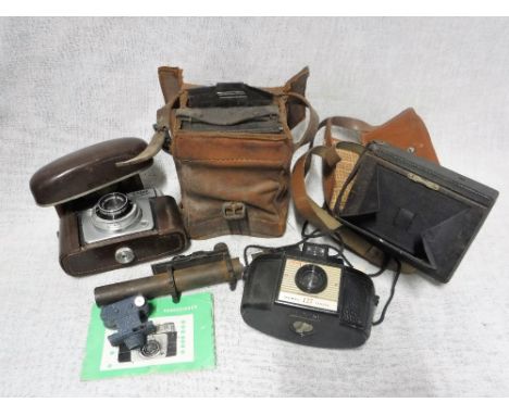 A VINTAGE PLATE CAMERA, an Ilford camera and other cameras and a sight (one box)