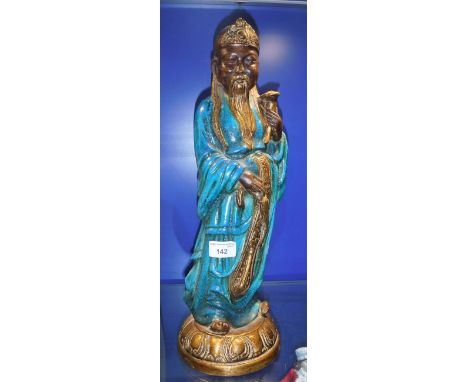 A TURQUOISE GLAZED CERAMIC FIGURE OF A DEITY, marked to the underside 'Italy'