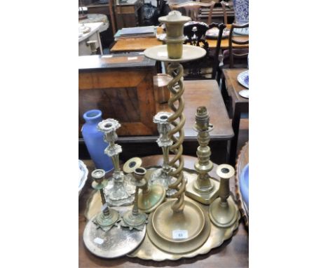 A PAIR OF SILVER PLATED CANDLESTICKS, a large spiral brass candlestick and similar metalware