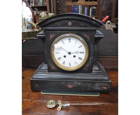 A VICTORIAN SLATE CASED MANTEL CLOCK (pendulum and key in office)