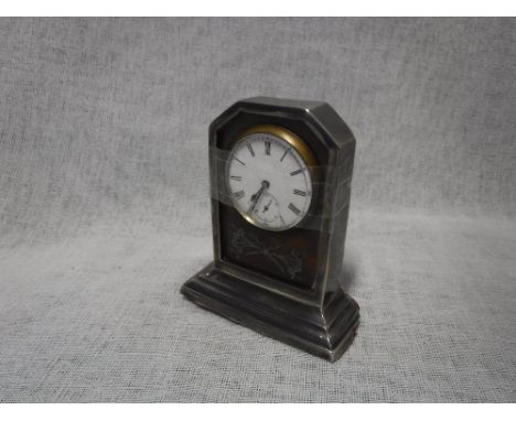 AN EDWARDIAN SILVER AND TORTOISESHELL TIMEPIECE, with a white enamel dial and subsidiary dial, Birmingham 1910, 9.5cms high