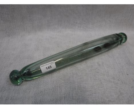 A CLEAR GLASS ROLLING PIN containing two early 19th century Farthings