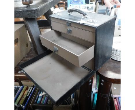 A VINTAGE LEATHER CASE fitted drawers to the interior