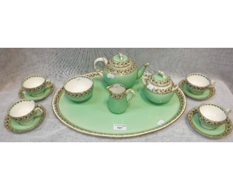 A ROYAL WORCESTER 'CABARET' SET comprising teapot, tray and other items, decorated in pale green with floral borders 