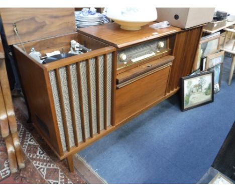 A VINTAGE 'BLAUPUNKT' RADIOGRAM in a teak case with a 'Garrard' record player, 59" long