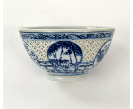 Chinese Blue an White Reticulated Bowl, Transition, 17th century, the small bowl with five circular roundels enclosing floral