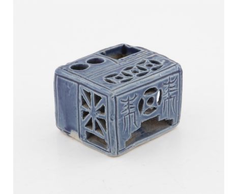 A Chinese Square Blue Glazed Calligrapher Inkwell, Qing dynasty decorated with two auspicious characters, unglazed on the bas