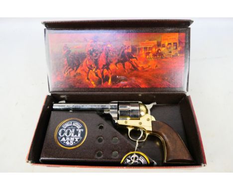 A boxed replica Single Action Colt Army 45 by Kolser. [W]Note: VCR Act applies buyer must be over 18 and able to prove member