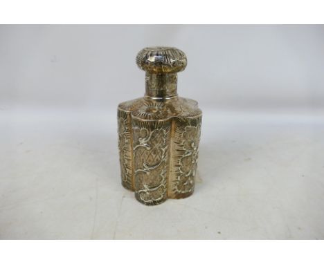 A foreign silver tea caddy of cinquefoil section with repousse decoration, London assay 1895 with foreign import mark, import