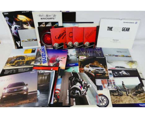 A quantity of brochures / promotional materials relating to motorcycle, automobile, construction vehicles to include Alfa Rom