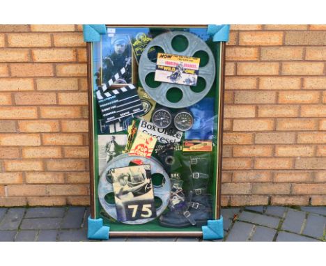 A decorative display montage of cinema / movie related items to include pictures of movie stars, model clapperboard, film stu