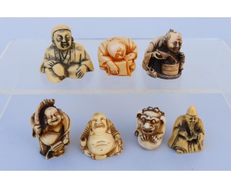 A collection of faux ivory netsuke, various figures and beasts, largest approximately 4.5 cm (h). [W]