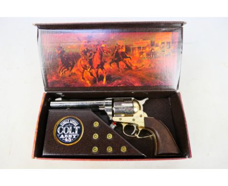 A boxed replica Single Action Colt Army 45 by Kolser. [W]Note: VCR Act applies buyer must be over 18 and able to prove member