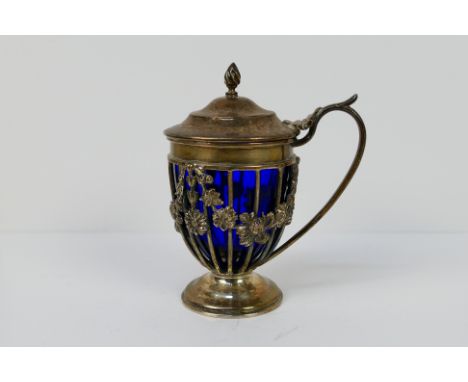 A late Victorian silver mustard pot of Neoclassical form, London assay 1899, sponsors mark for Haseler Brothers, with blue gl