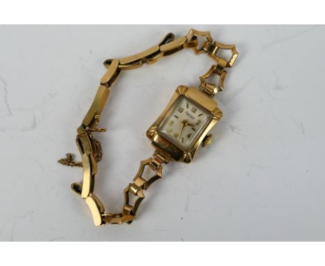 A lady's Rotary gold watch, the square face with gold coloured baton markers, the case, bracelet links and clasp all marked a