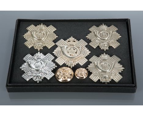 FIVE HIGHLAND LIGHT INFANTRY CAP BADGES 
and two buttons, boxed
