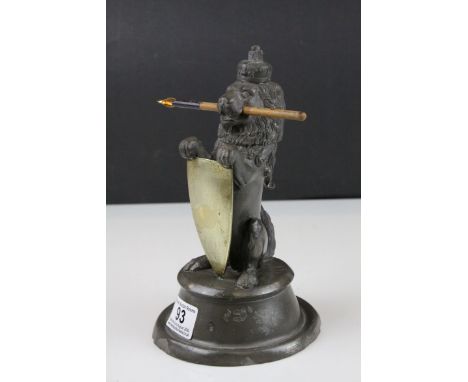 19th century Pewter Inkwell and Quill Holder in the form of a Lion sitting on his back legs and holding a Brass Shield Shaped