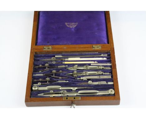 A vintage draftsman's drawing tool set in original fitted wooden case.