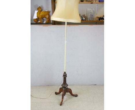 Wooden Standard Lamp raised on carved supports and three splay legs