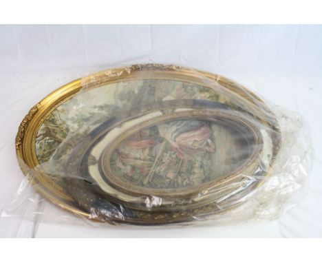 A large oval gilt framed tapestry of regency couple and three vacant vintage oval frames 