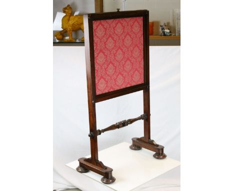 William IV Mahogany Framed Firescreen with fabric covered panel, raised on trestle supports each with two carved leaf feet  h