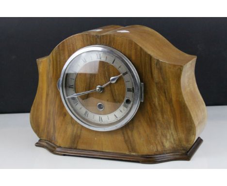 A 1940s burr wood  fronted mantle clock with three train westminster chime movement. 