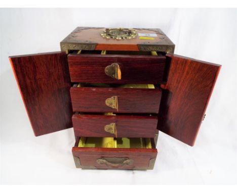 A good quality wooden cabinet box with brass fittings and three internal drawers