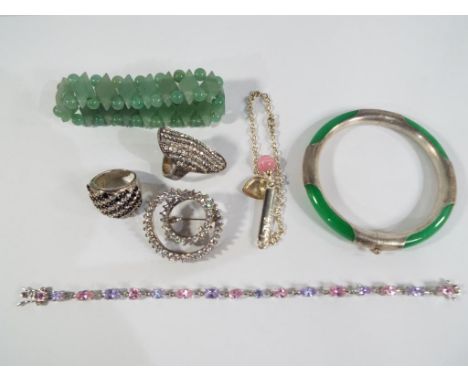 A good mixed lot of silver dress jewellery to include a white metal and jade bangle, a beaded jade bracelet, rings, bracelet 