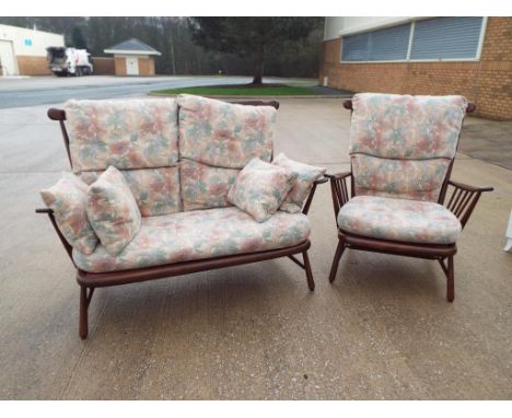 An oak framed modern upholstered spindle back settee and matching armchair by Ercol Est £50 - £70