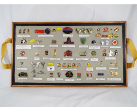 A collection of enamel pin badges. Estimate £30 - £50