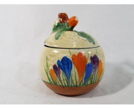 Clarice Cliff - a small covered globular preserve pot decorated with crocus, 9 cm (h) - Est £70 - £90