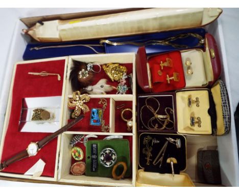 A good mixed lot of costume jewellery to include a silver necklace and bracelet set, brooches, rings, a jewellery box, cuffli