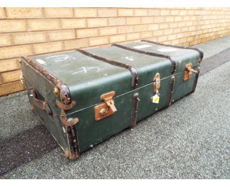 A large wooden travellers trunk with metal trim 28 cm x 90 cm x 50 cm