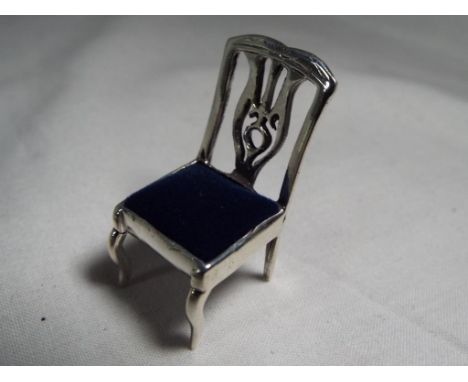 An unusual pin cushion in the form of a chair stamped 925 Est £25 - £40