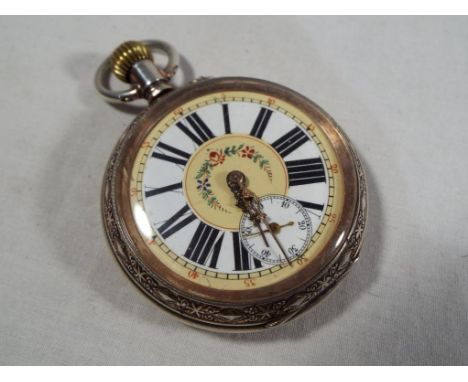 A decorative silver cased pocket watch, beige enamel dial with white chapter ring, Roman numerals and floral swag, subsidiary