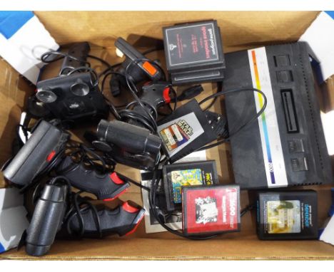 An Atari 2600 games console to include six controllers and eight games cartridges to include Pac-man, Star wars the Empire St