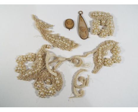 Two soapstone pendants depicting faces and a micro beaded and pearl patch, Estimate £30 - £50