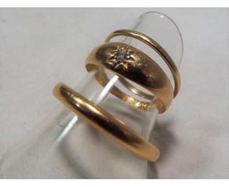 A hallmarked 9 carat gold wedding band, 0.55 grams, a hallmarked 18 carat gold ring set with single diamond, size K approxima