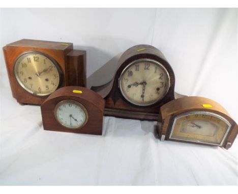 Four wooden cased mantel clocks to include a Napoleon hat styled Westminster chiming clock, two Art Deco styled clocks and a 