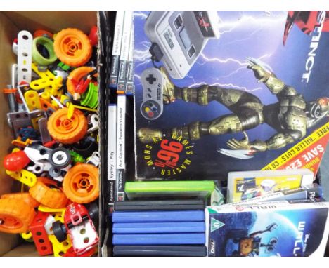 A Super Nintendo entertainment system, boxed, 22 console games mainly Playstation 2 and other and a quantity of modern Meccan