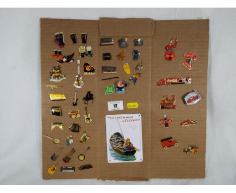 A collection of enamel pin badges to include Guinness, Hard Rock Cafe, Coca Cola and similar. Estimate £30 - £50