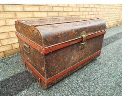 A large tin travellers trunk, approximately 42 cm (h) x 77 cm (w) x 52 cm (d)