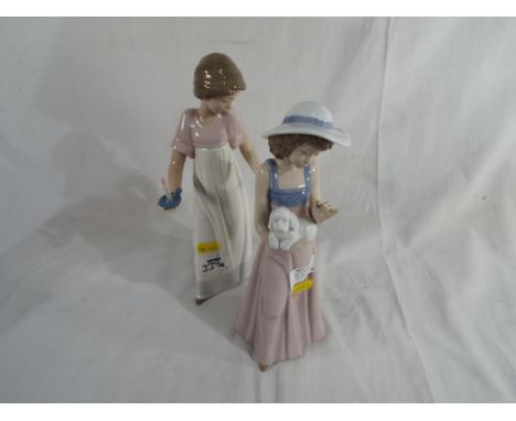 Nao - A figurine of a girl holding a dog and a figurine of a girl carrying a candlestick.